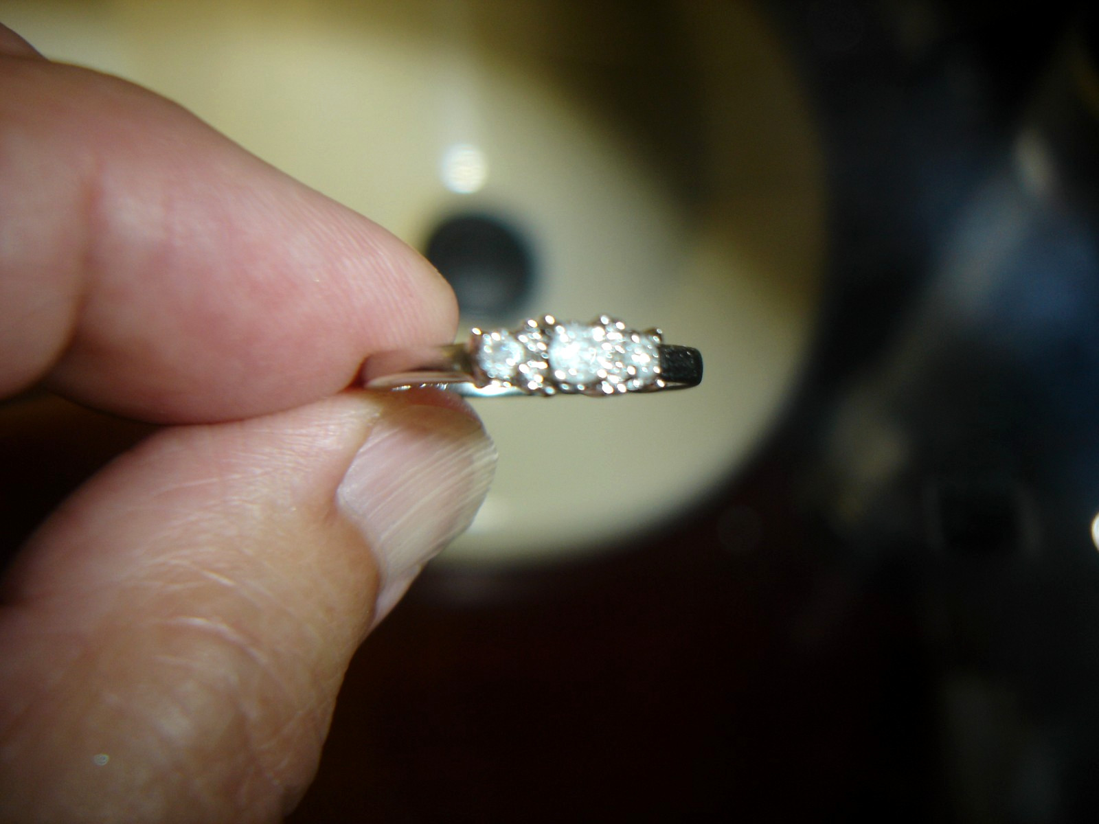 1OK WHITE GOLD AND .5 CTW 3 DIAMOND RING IN SIZE 6.75