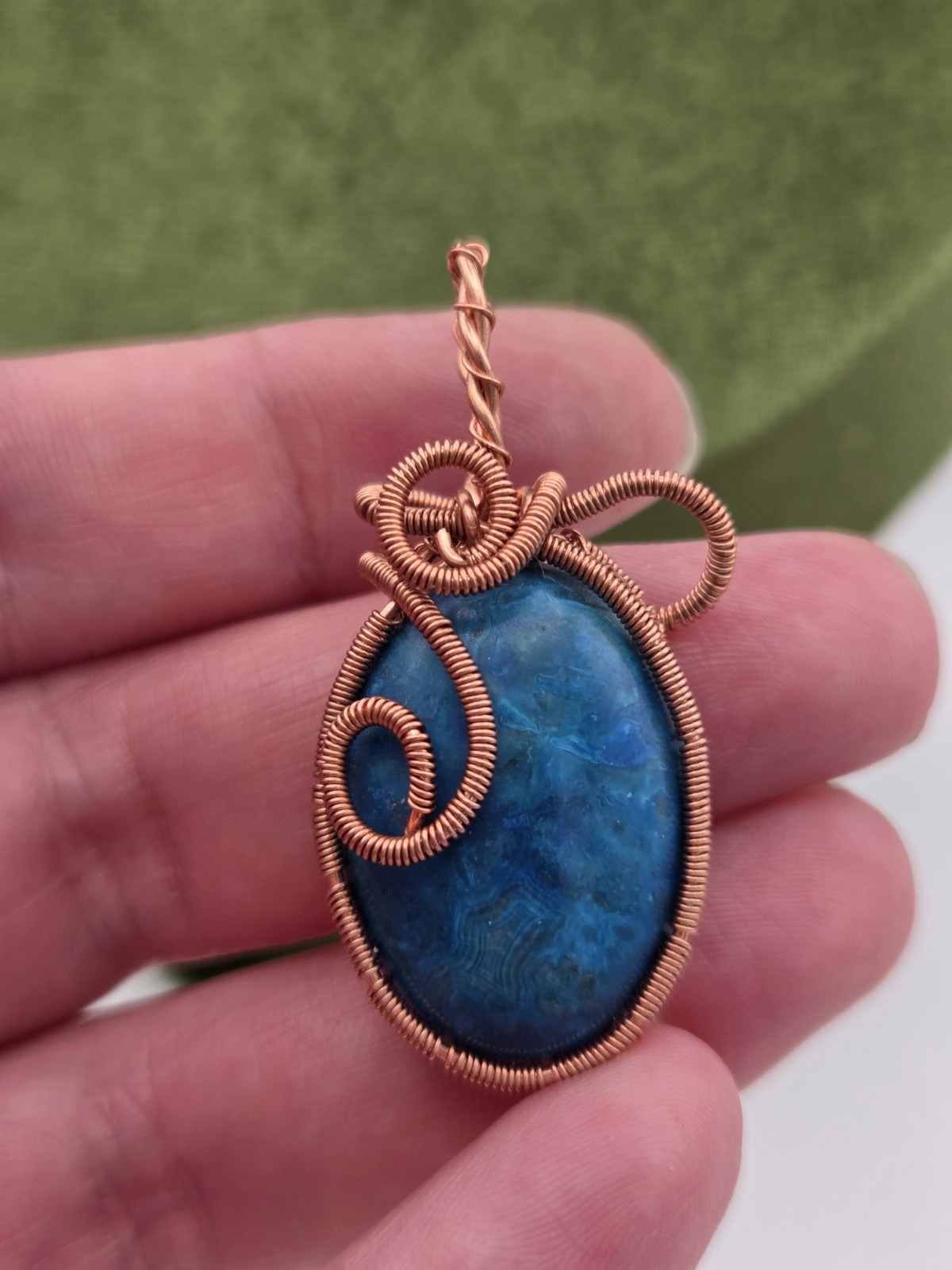 Handcrafted copper wire-wrapped blue Orchid stone pendant