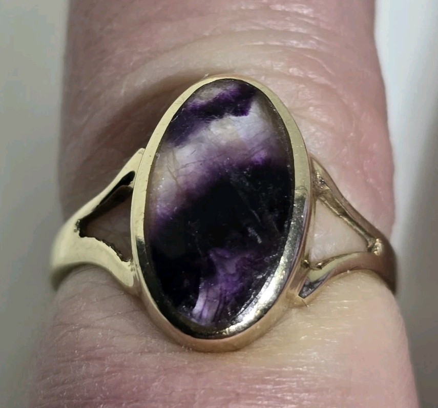 9ct Yellow gold open work ring. Collet set with an oval Blue John Cabochon.