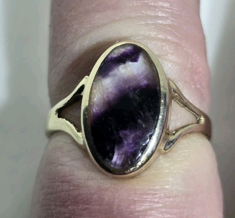 9ct Yellow gold open work ring. Collet set with an oval Blue John Cabochon.
