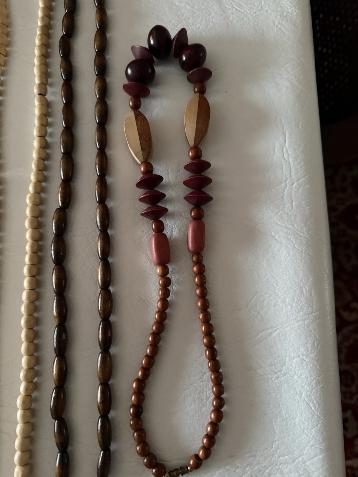 Lot of 10 necklaces, mostly wood beads, some Lucite, ethnic look earth tones