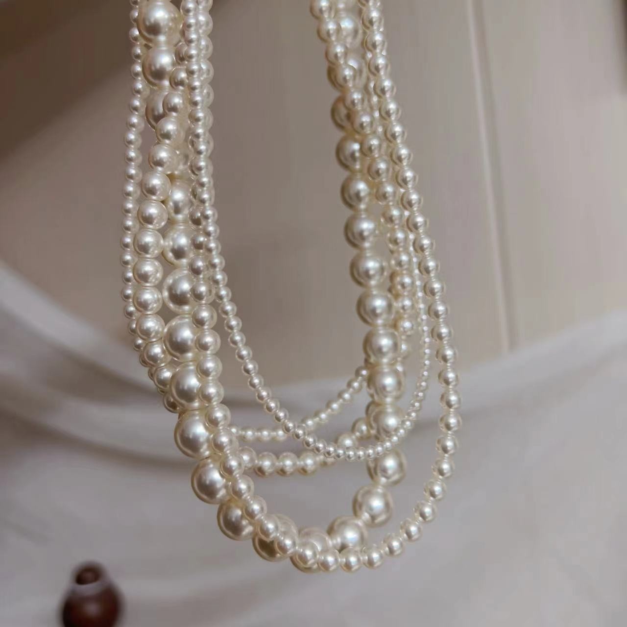 650 Warm White Perfectly Round High-Intensity Pearl Necklace