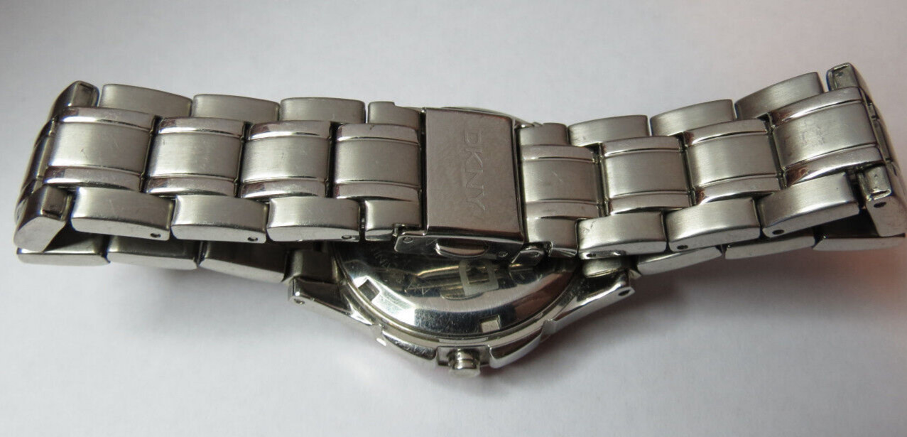 NICE WOMENS DKNY QUARTZ SPORT 5 ATM PINK BEZEL WATCH FRESH BATTERY RUN’S,