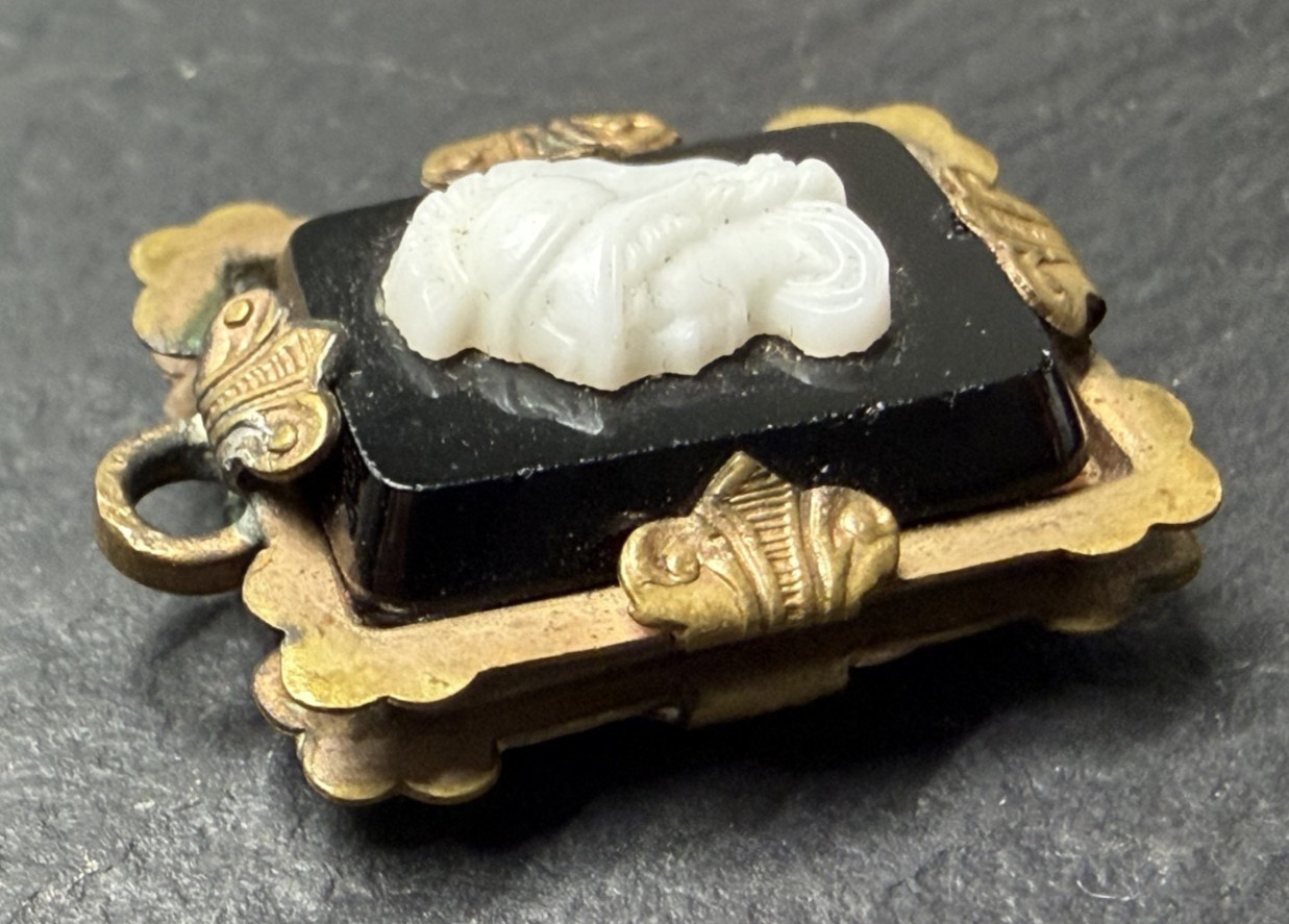 ANTIQUE METAL FOB / PENDANT WITH BLACK & WHITE PROFILE N885