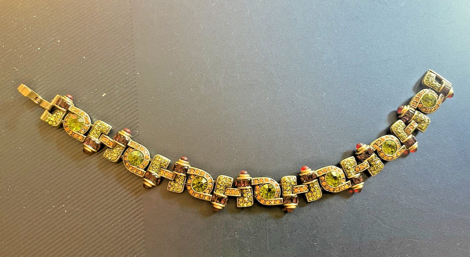 New Heidi Daus Bracelet in Original Packing. Olive Green, Red, Yellow Crystals.