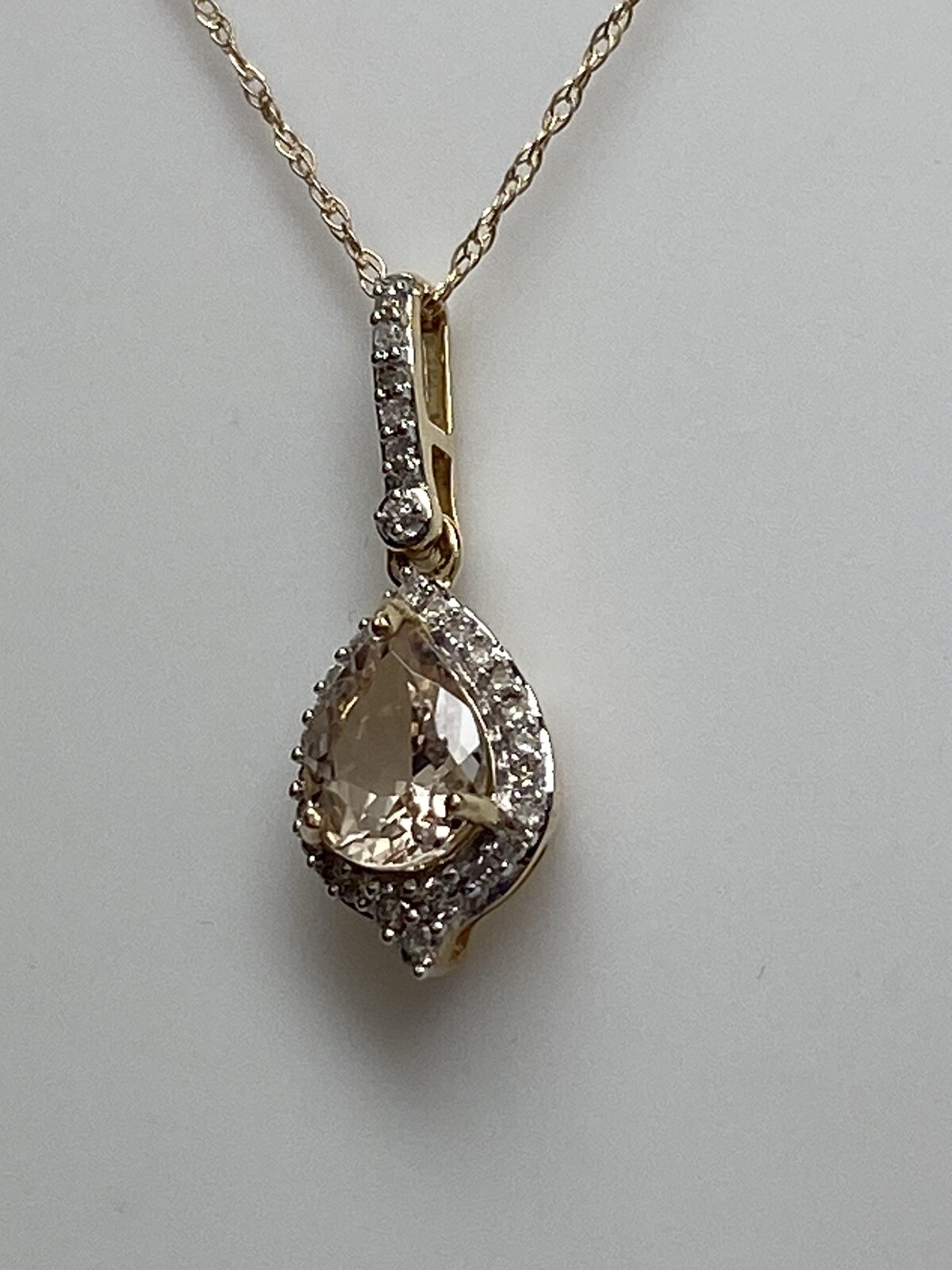 10K Yellow Gold Pear Shape Morganite and 0.11ct twt. Diamond Pendant with Chain