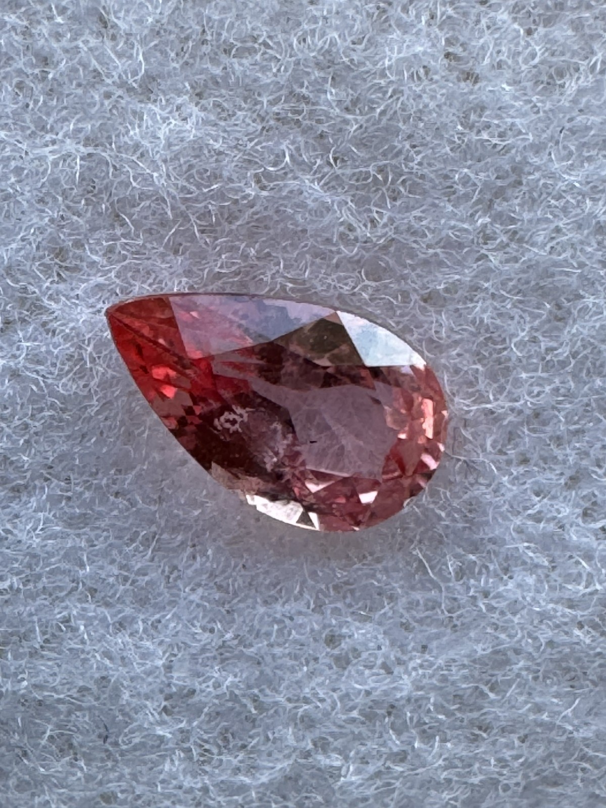 GIA Orangy Pink Sapphire Pear. 0.67 Carats 7.1 x 4.2 mm VSI, Beryllium Diffused