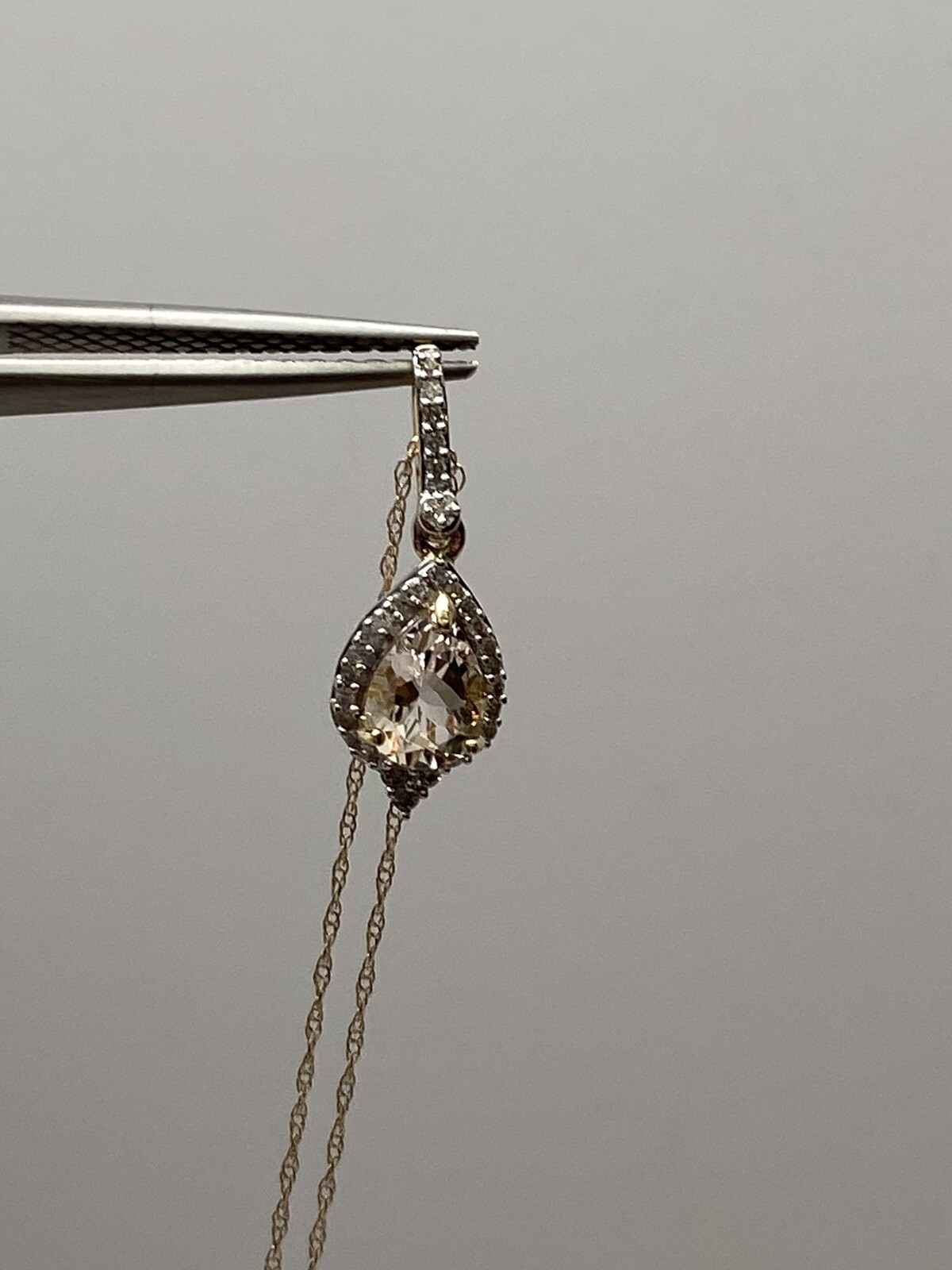 10K Yellow Gold Pear Shape Morganite and 0.11ct twt. Diamond Pendant with Chain
