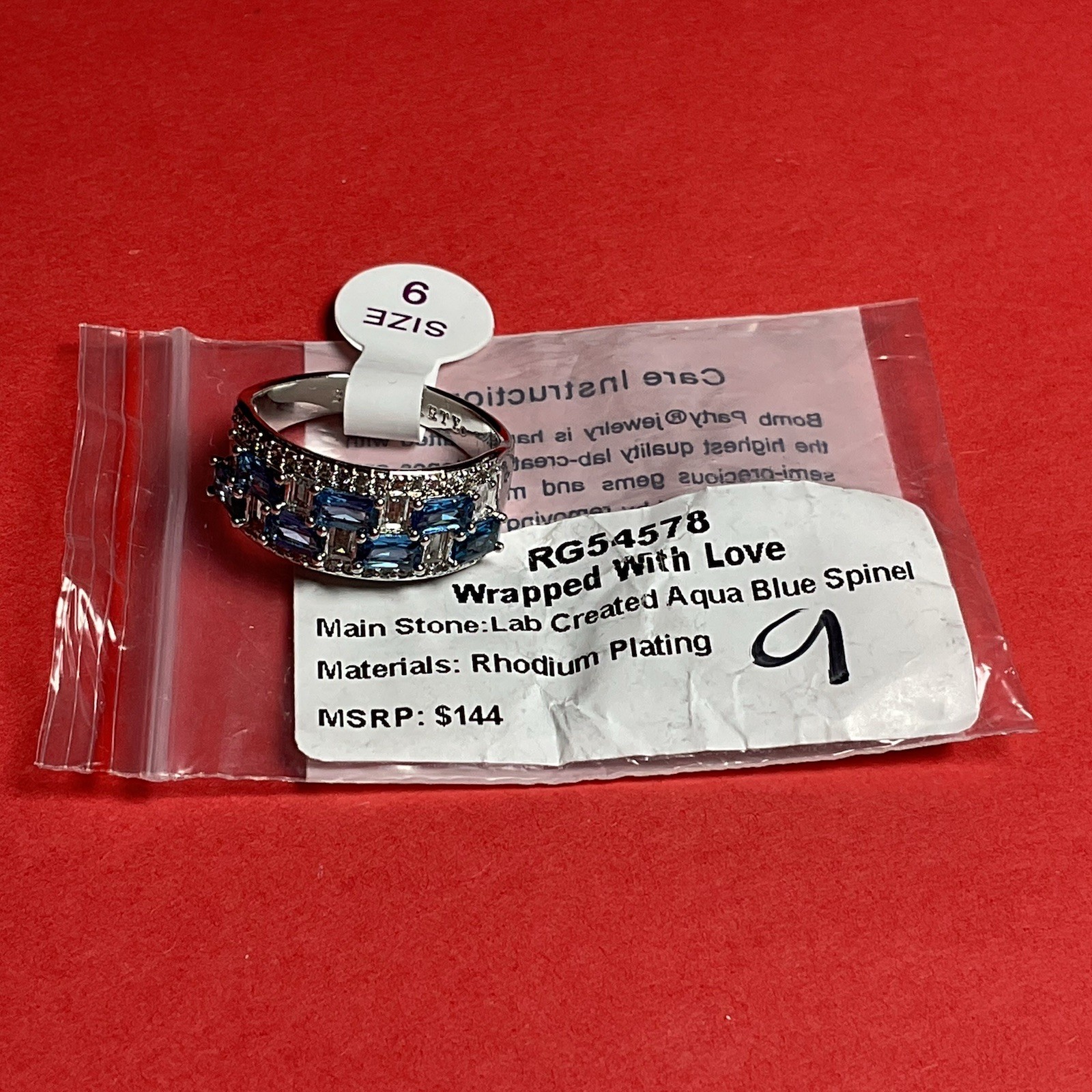 Bomb Party RG54578 “Wrapped With Love” Lab Created Spinel Rhodium Sz 9 Ring NWT