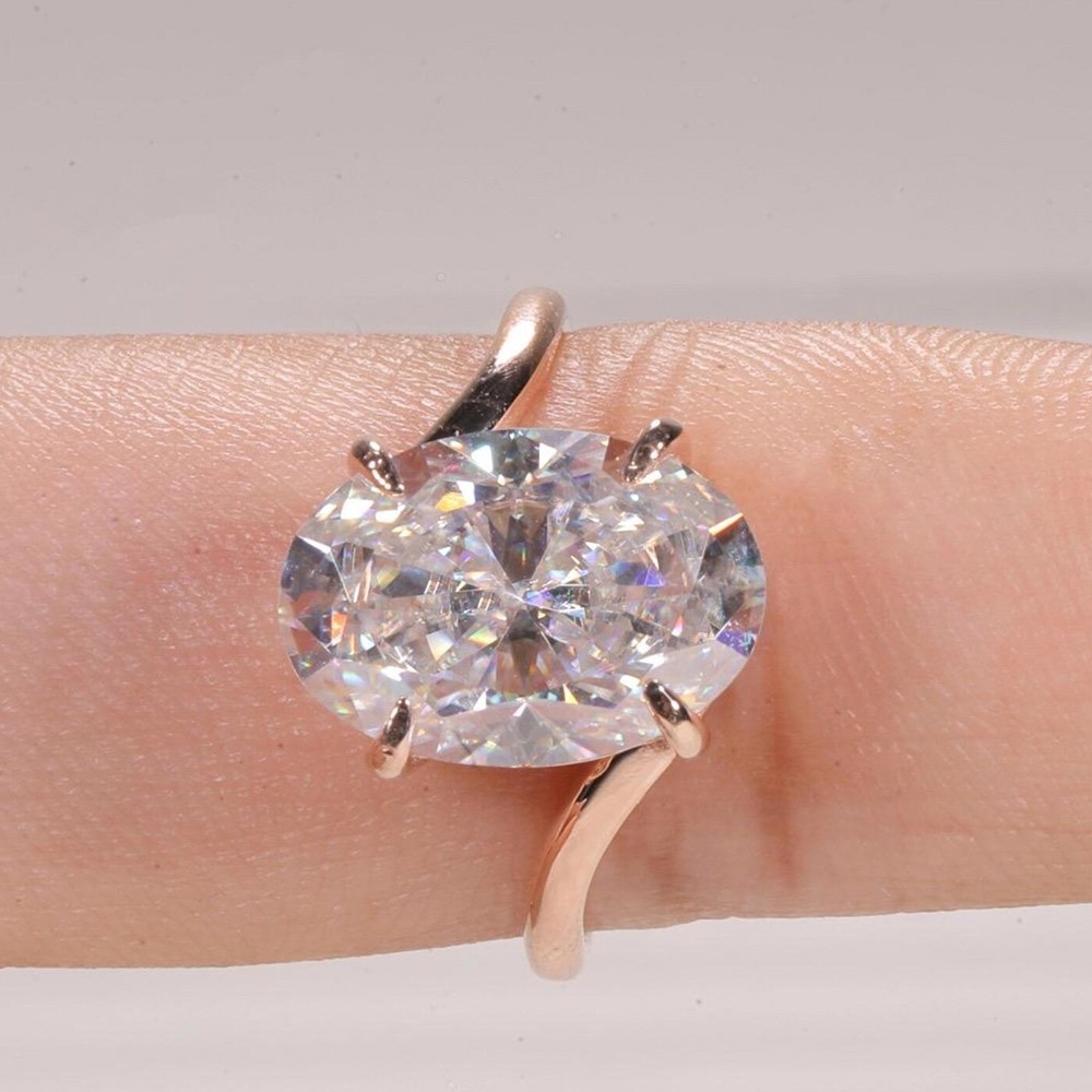 5.50 CTW Oval Cut VVS1 Moissanite Bypass Engagement Ring In 14k Rose Gold Plated