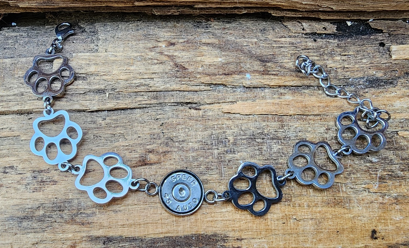 Bullet Bracelet, Stainless Steel Puppy Paws and 45 Auto. Optional Glass Crystal.