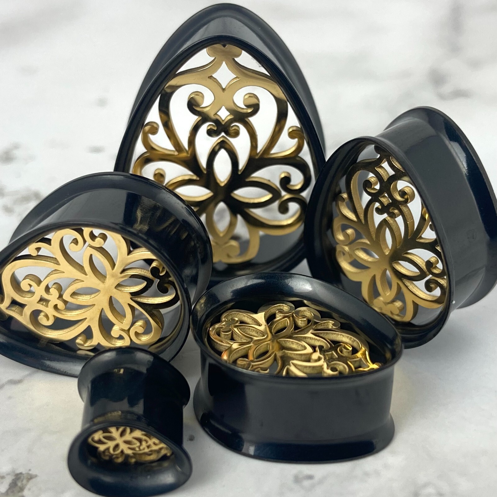 Pair Black Steel Teardrop Tunnels Gold Steel Inlay (PS-283) gauges plugs