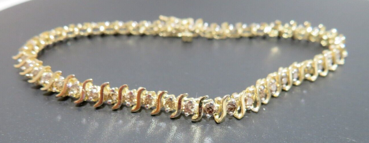 10K LADIES DIAMOND TENNIS BRACELET 1.00 tcw 7″ LONG 4.49 MM WIDE 6.42g(6132597-9