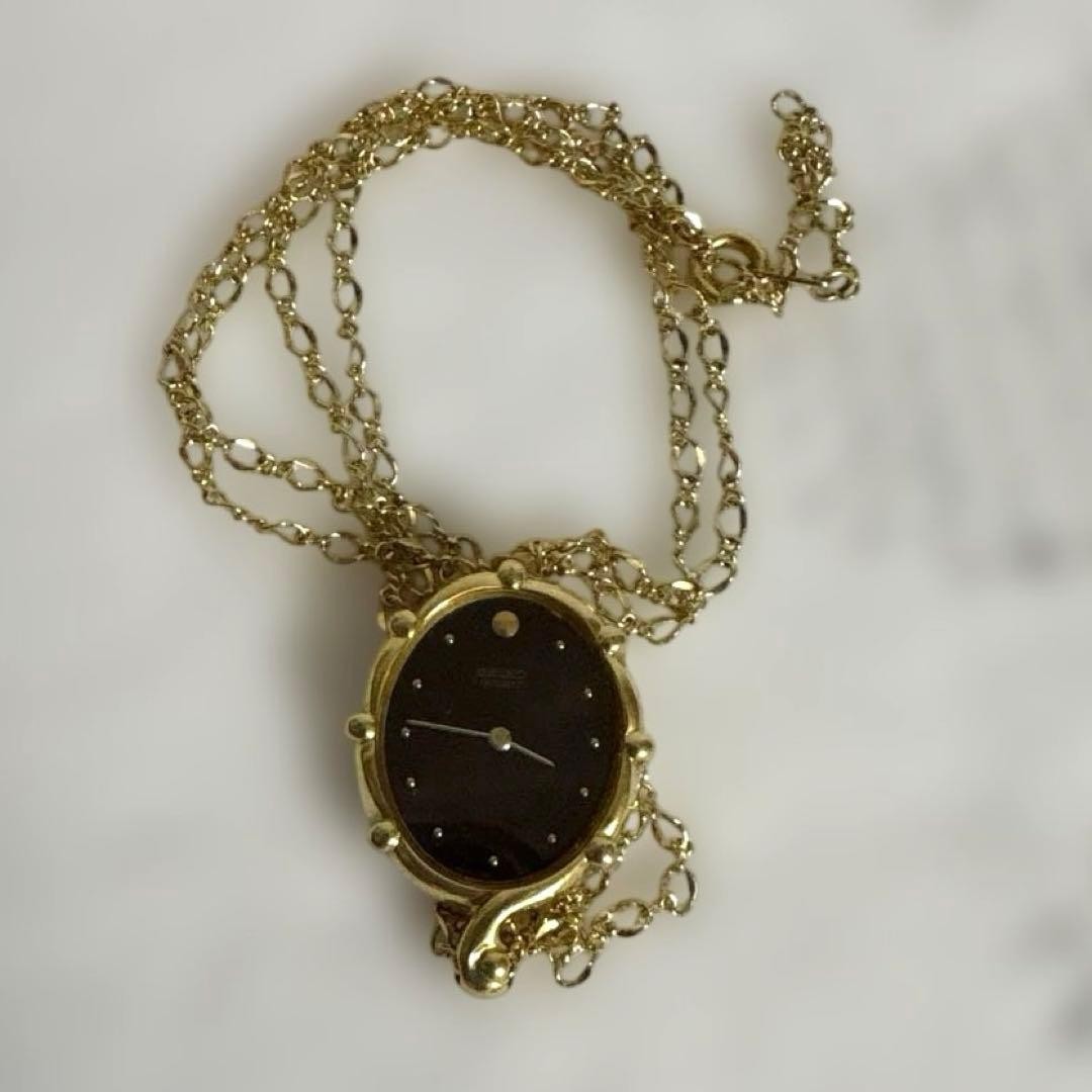 Seiko pendant watch, gold chain, working, burgundy dial.