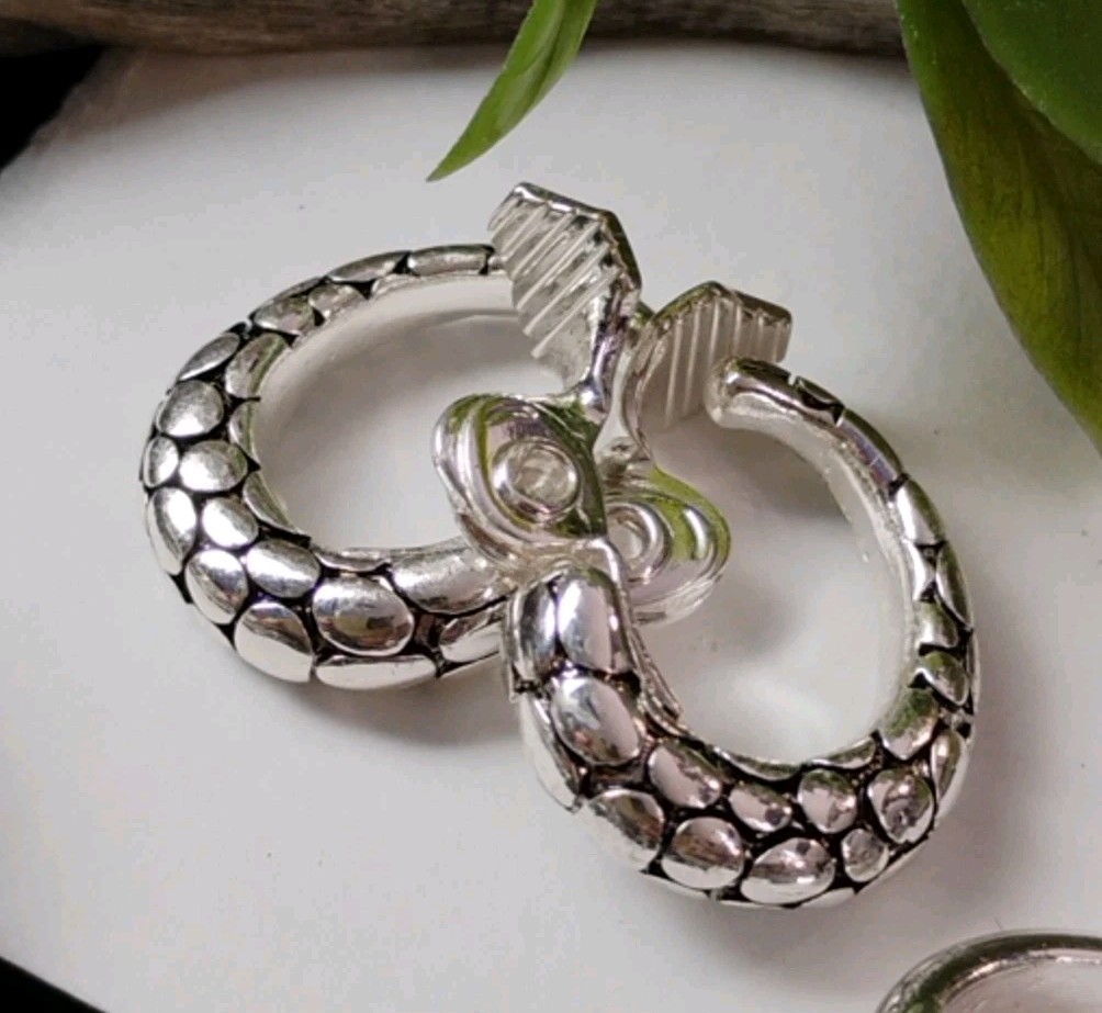 The JEWELRY GROUP TJG Set of THREE (3) Silver Toned Hoop Clip On Earrings!
