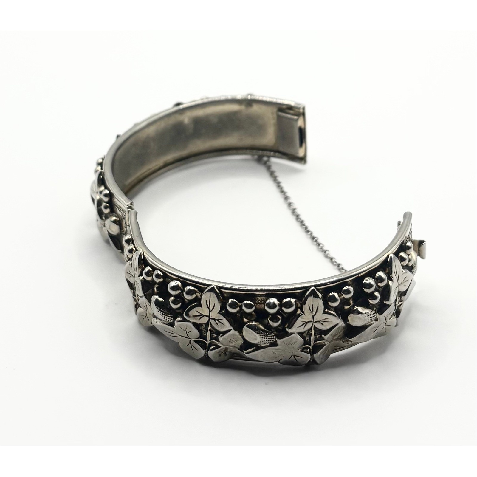 Vintage Silver Tone Embossed Floral Hinged Bangle Bracelet with Safety Chain