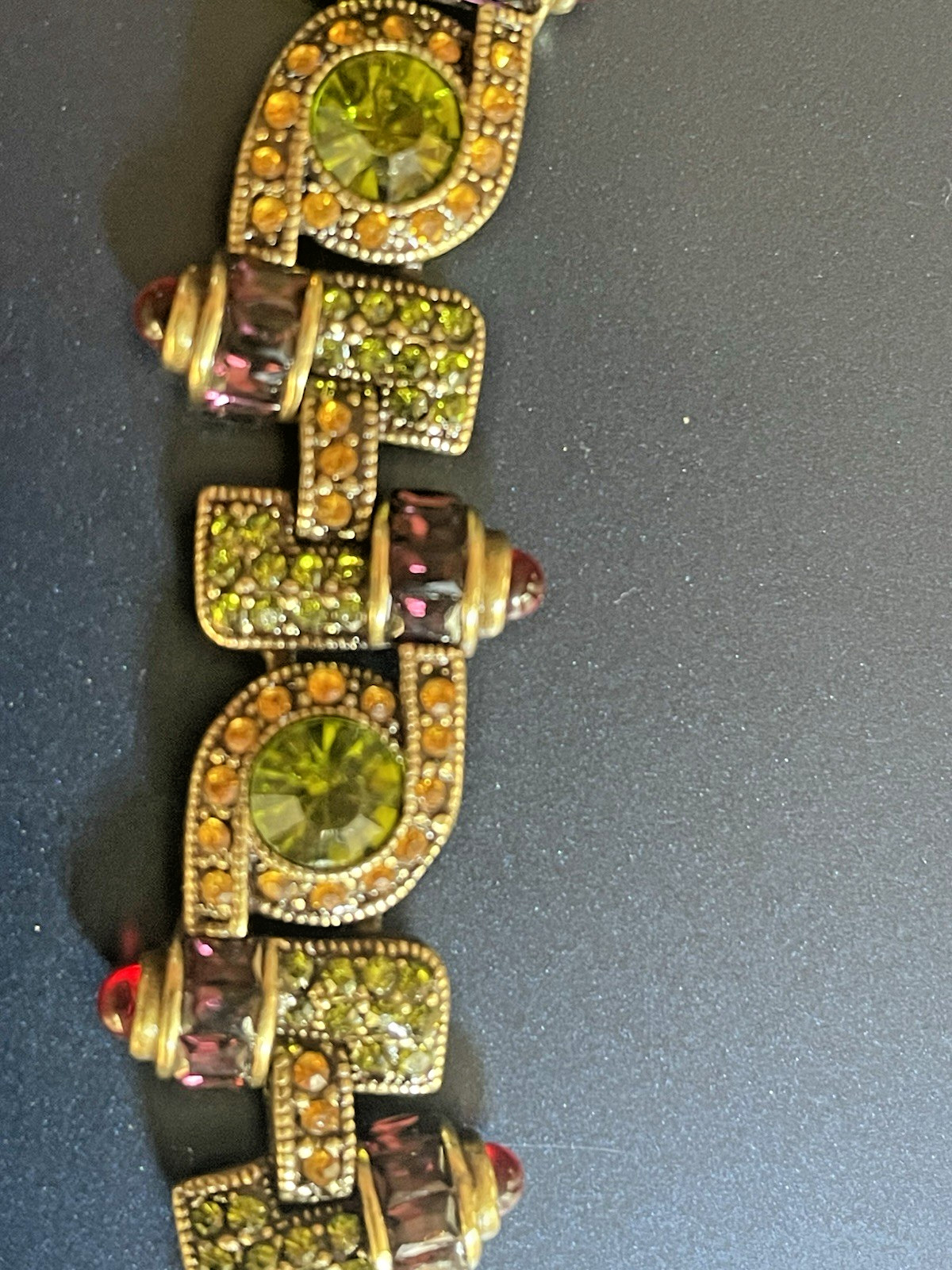 New Heidi Daus Bracelet in Original Packing. Olive Green, Red, Yellow Crystals.
