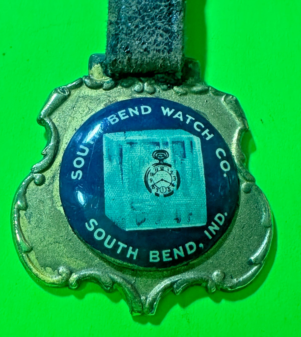 VINTAGE POCKET WATCH FOB SOUTH BEND WATCH CO. SOUTH BEND, IN. CELLULOID / METAL