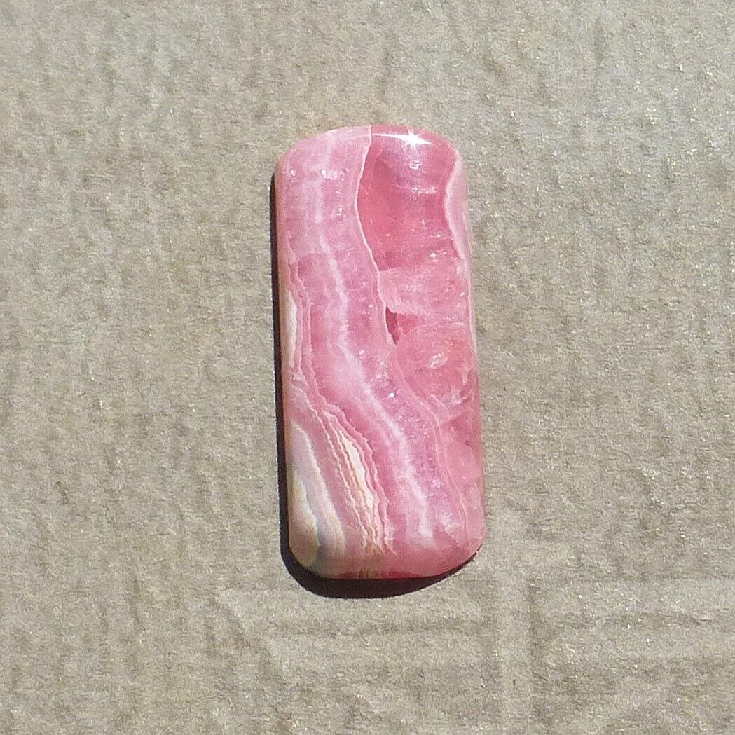 Pink w/calcite banding natural Rhodochrosite cabochon Argentina (27.60 carats)
