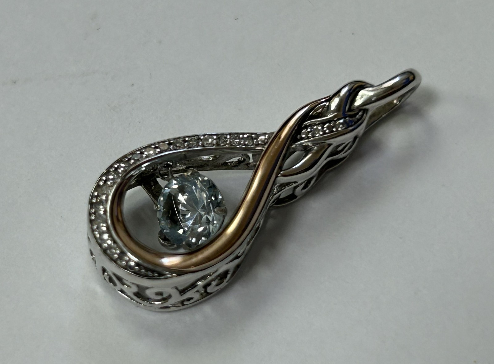 (MA6) OTC 925 / 14k “Rhythm of Love” Diamond Infinity Knot Pendant w/ Blue Topaz