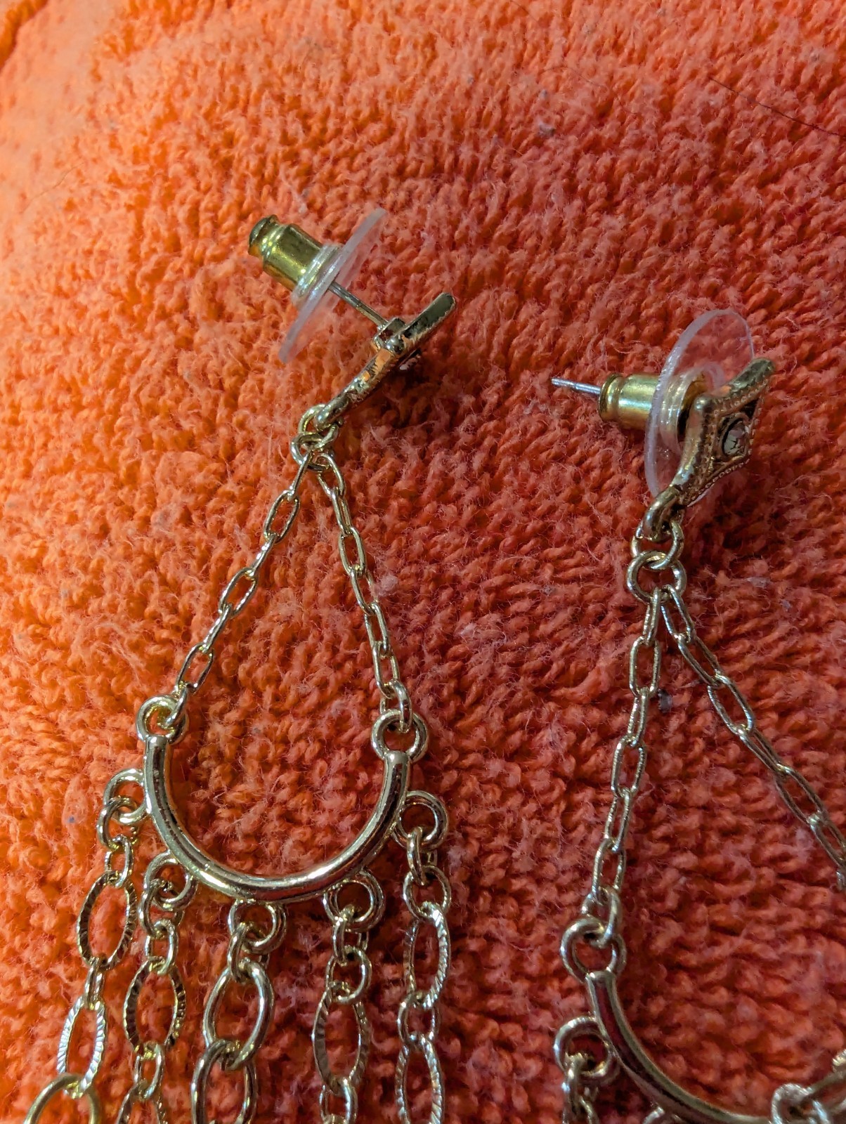 Earrings With Dangling Chains And Various Pendants