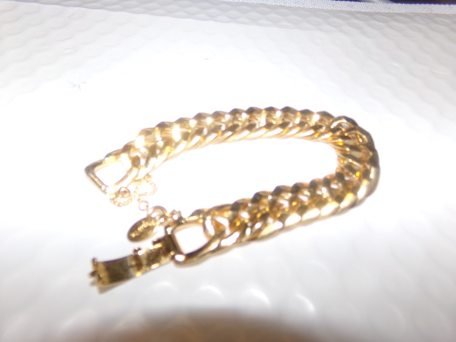 SIGNED ROGET TM GOLDTONE BRACELET WITH SAFETY CHAIN