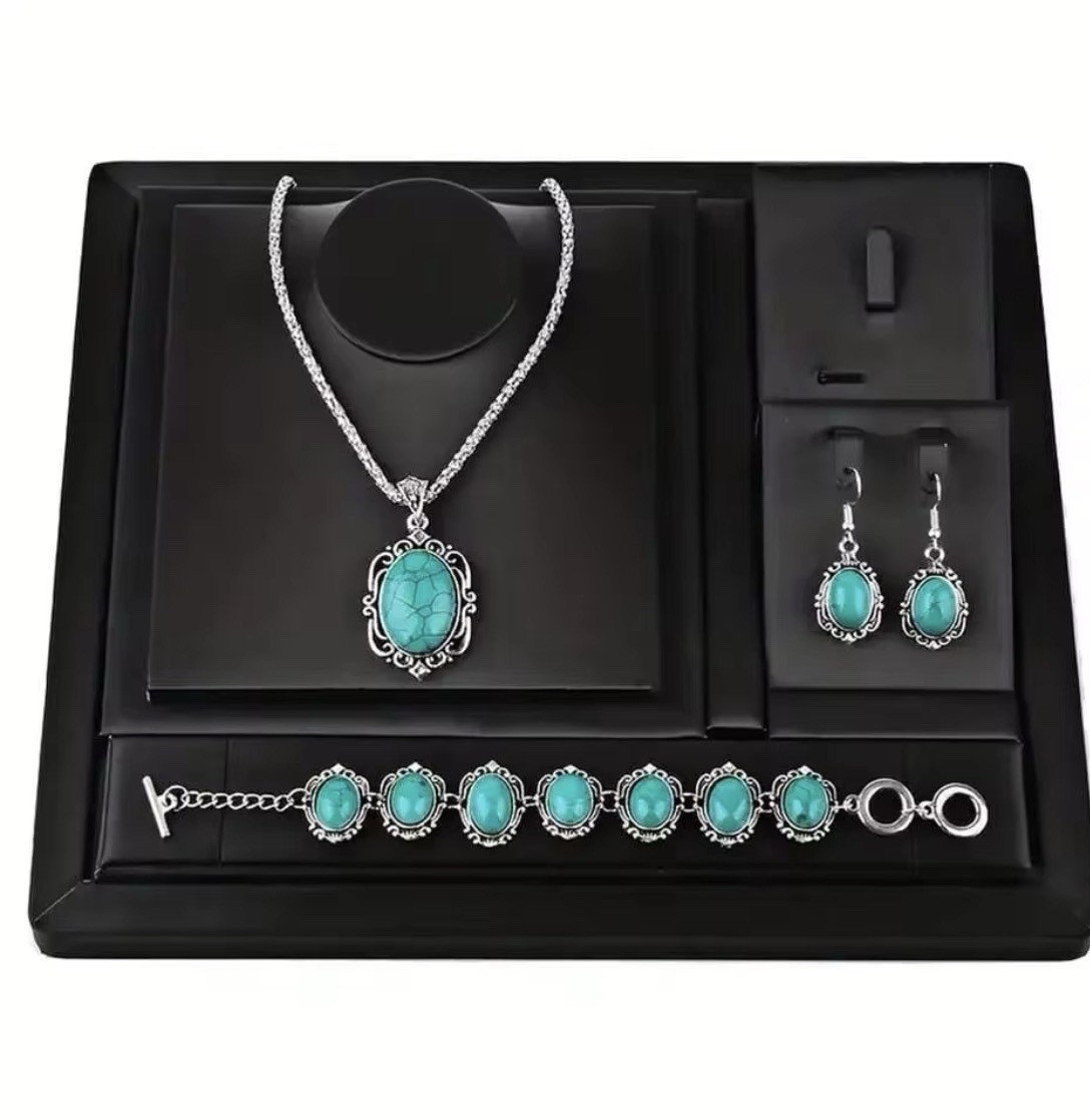 The jewelry set includes a matching necklace, earrings, and bracelet,