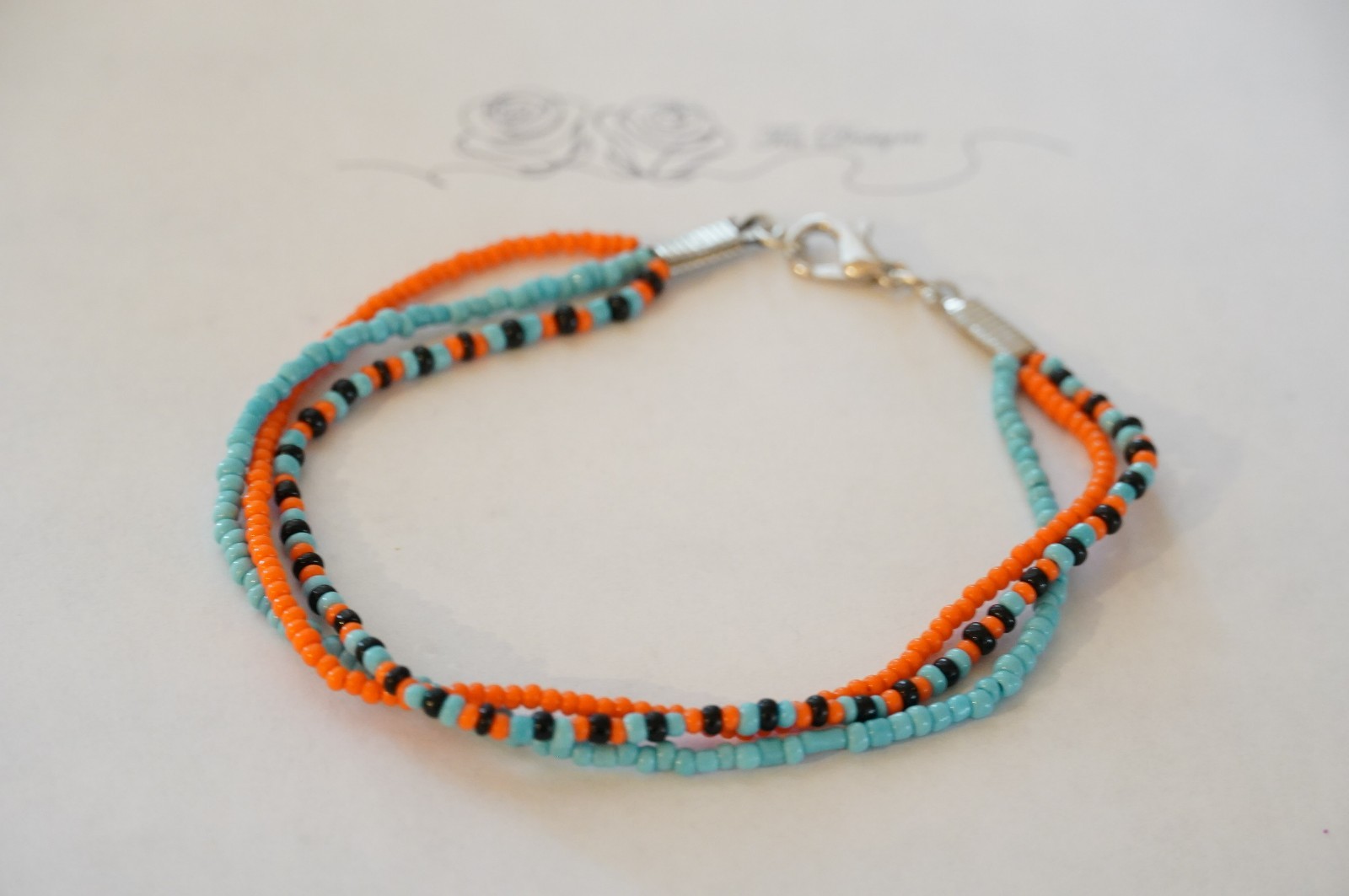 Multi-color Black, Blue, & Orange Glass Seed Bead 8″ Bracelet