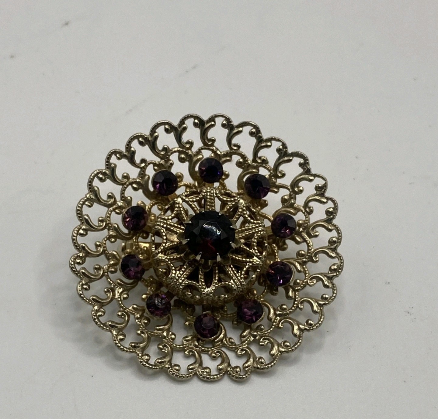 Gold Tone Round Filigree Brooch Pin w/ Purple Crystal Rhinestones, 2 in