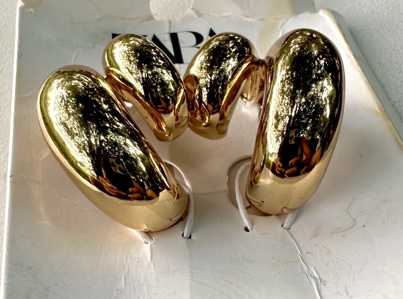 Zara Double Teardrop Earrings in gold.