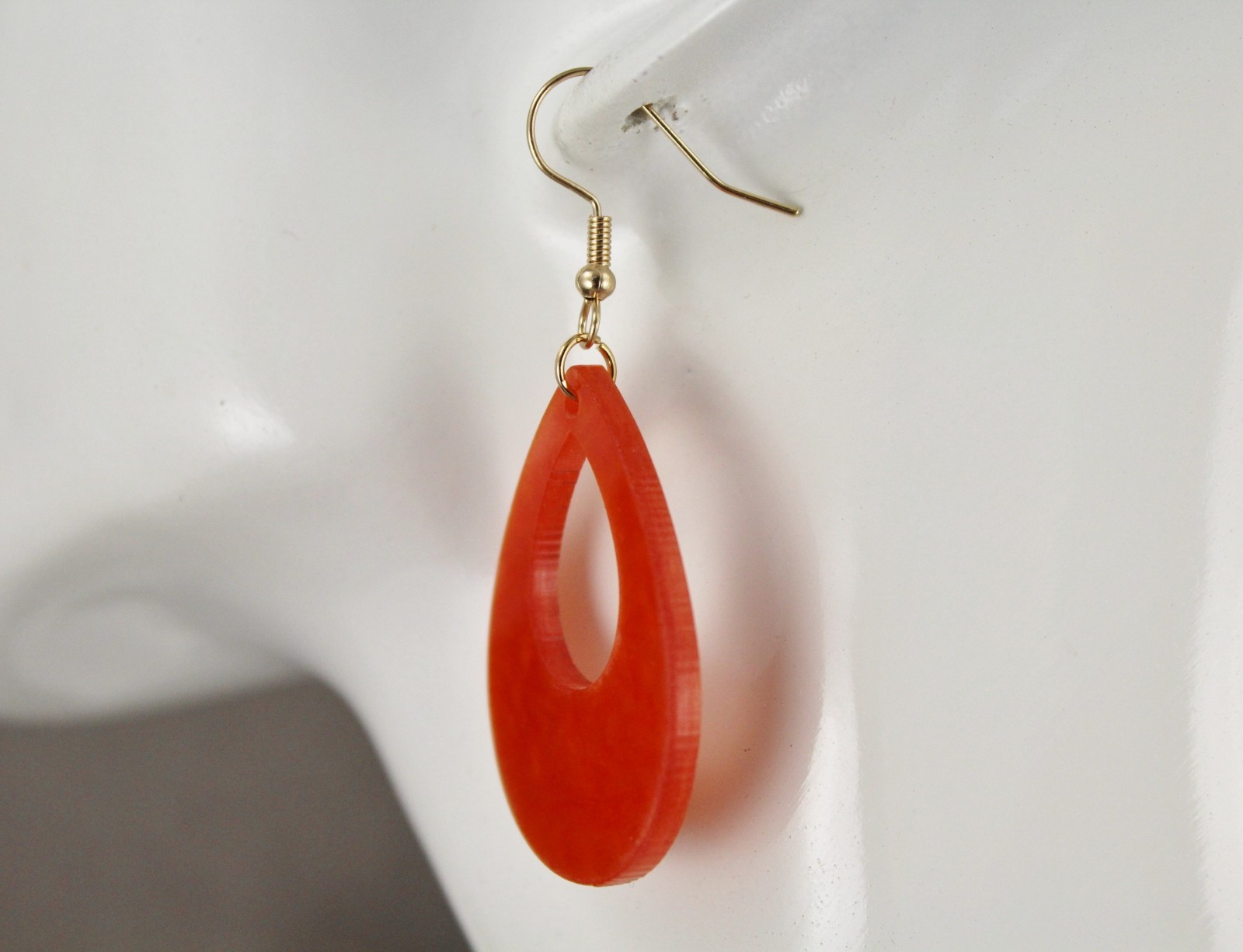 Orange teardrop earrings lightweight dangle cut out oval outline 2.25″ long
