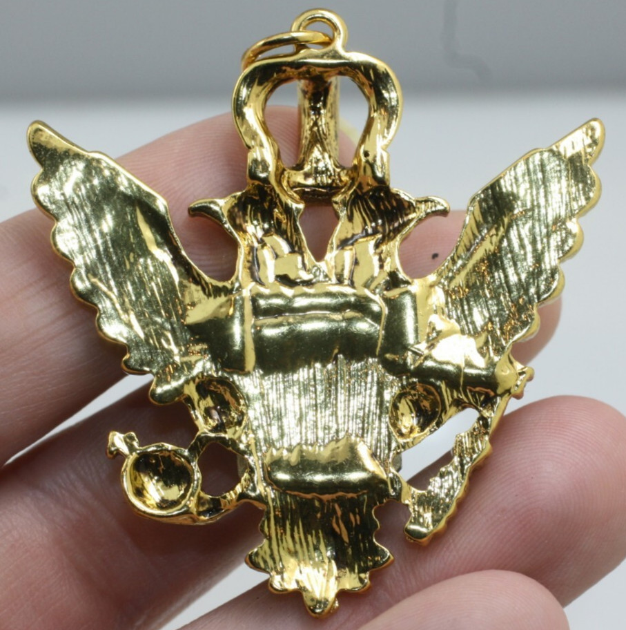 Gold tone double eagle crown blue emerald cut stone pendant regal style