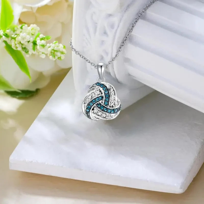 Sterling Silver Love Knot Pendant Necklace with Blue & White Sapphires
