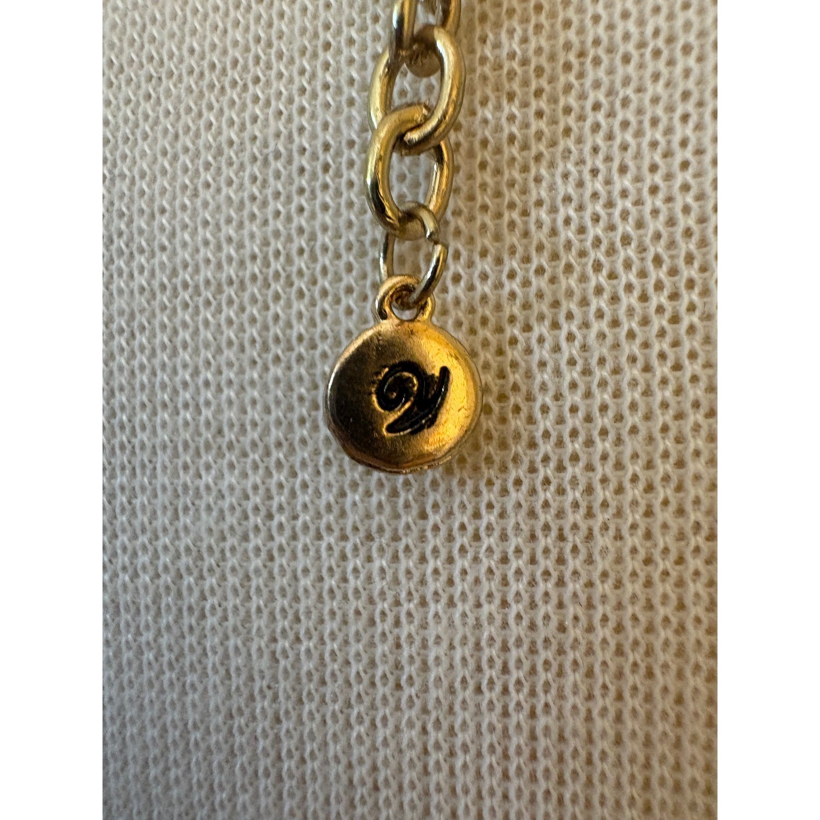 V Logo Gold Tone Hammered Oval Link Segmented Tube Statement Necklace