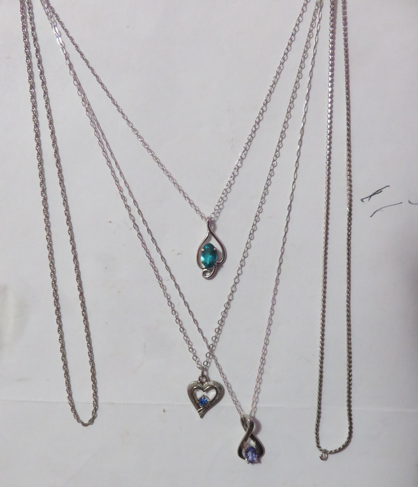 4 MARKED “STERLING” SILVER & ONE BGE CHAIN NECKLACES & 3 PENDANTS 8 GRAMS