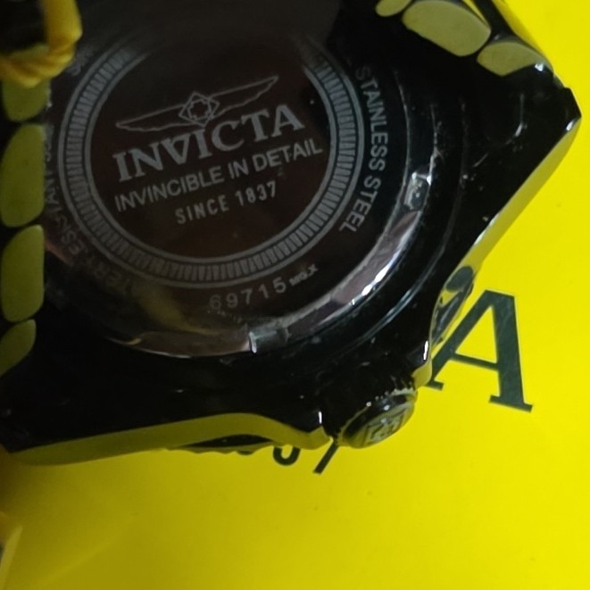 Invicta Men’s Quartz Analog Wristwatch 100m 44-47.9mm Orange Dial Black