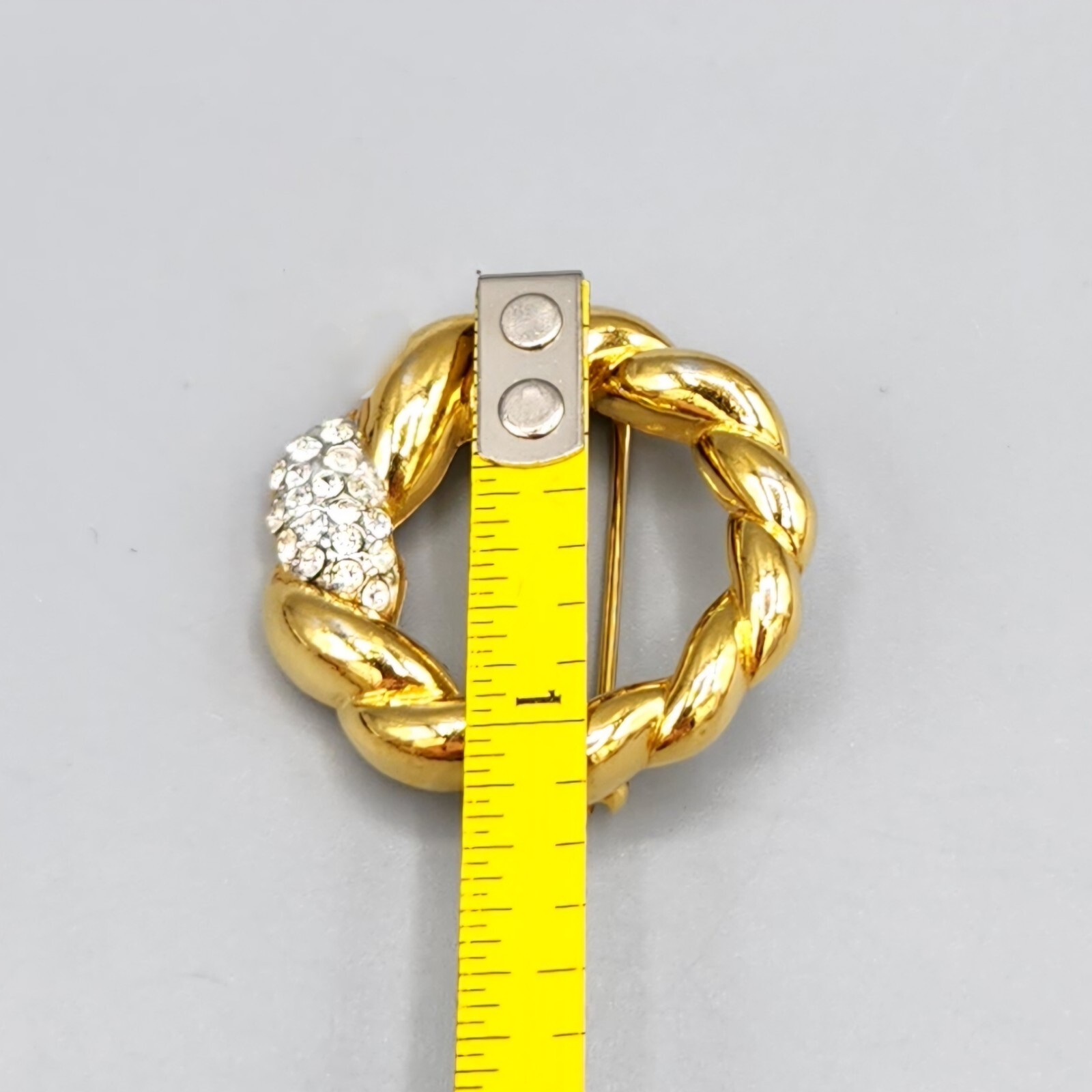 Crown Trifari Polished Gold Tone Crystal Pave Open Circle Twist Brooch