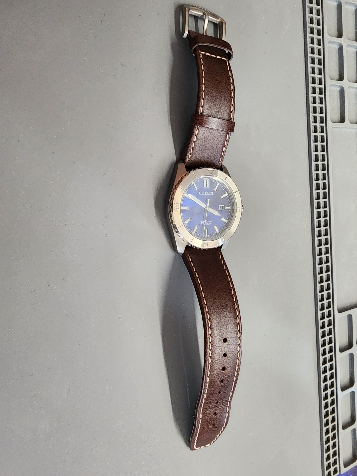 Citizen AW1840-09L Brycen Titanium Case Eco-Drive Leather Strap Blue Dial Watch