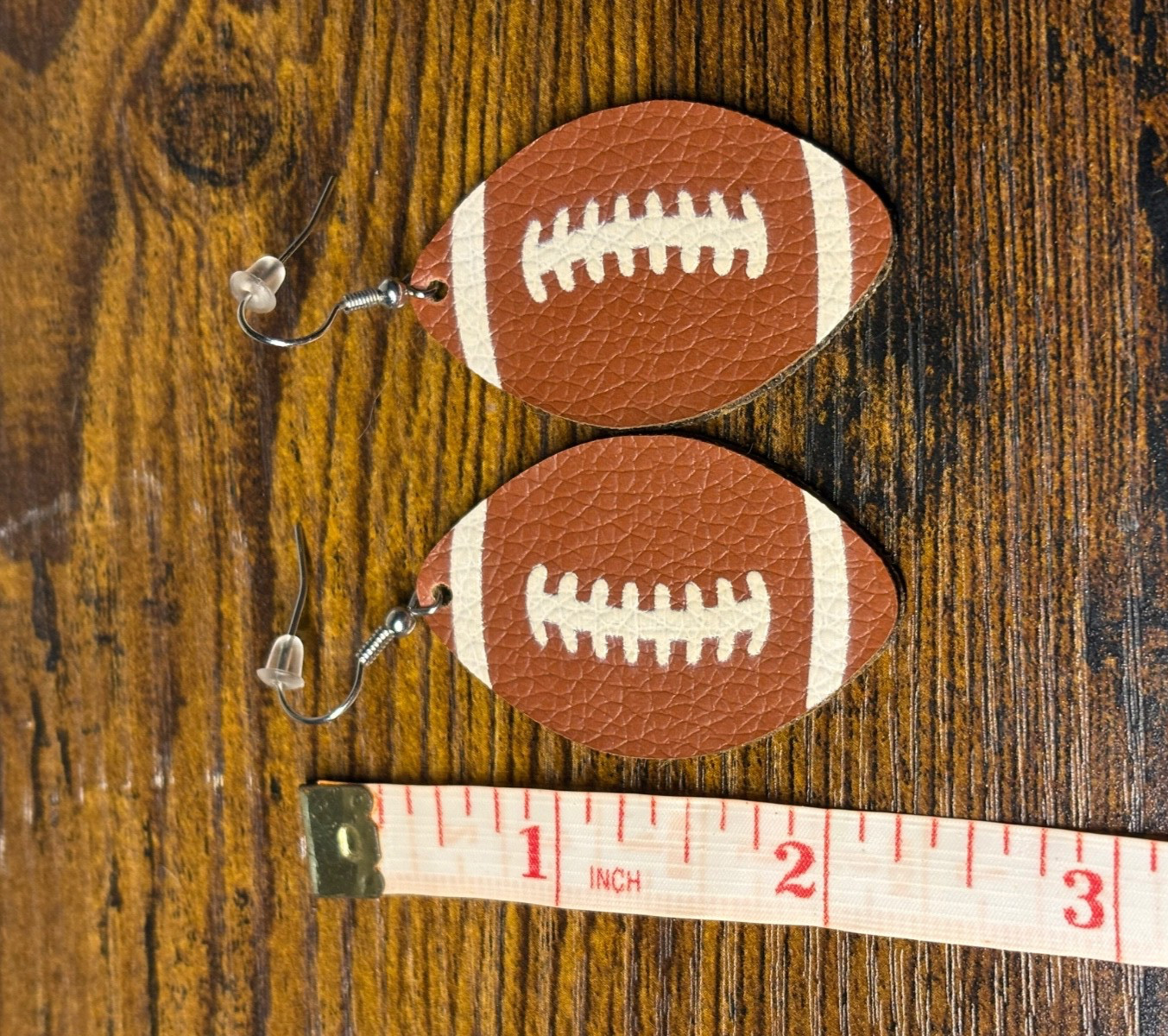 Crystal avenue football earrings faux leather