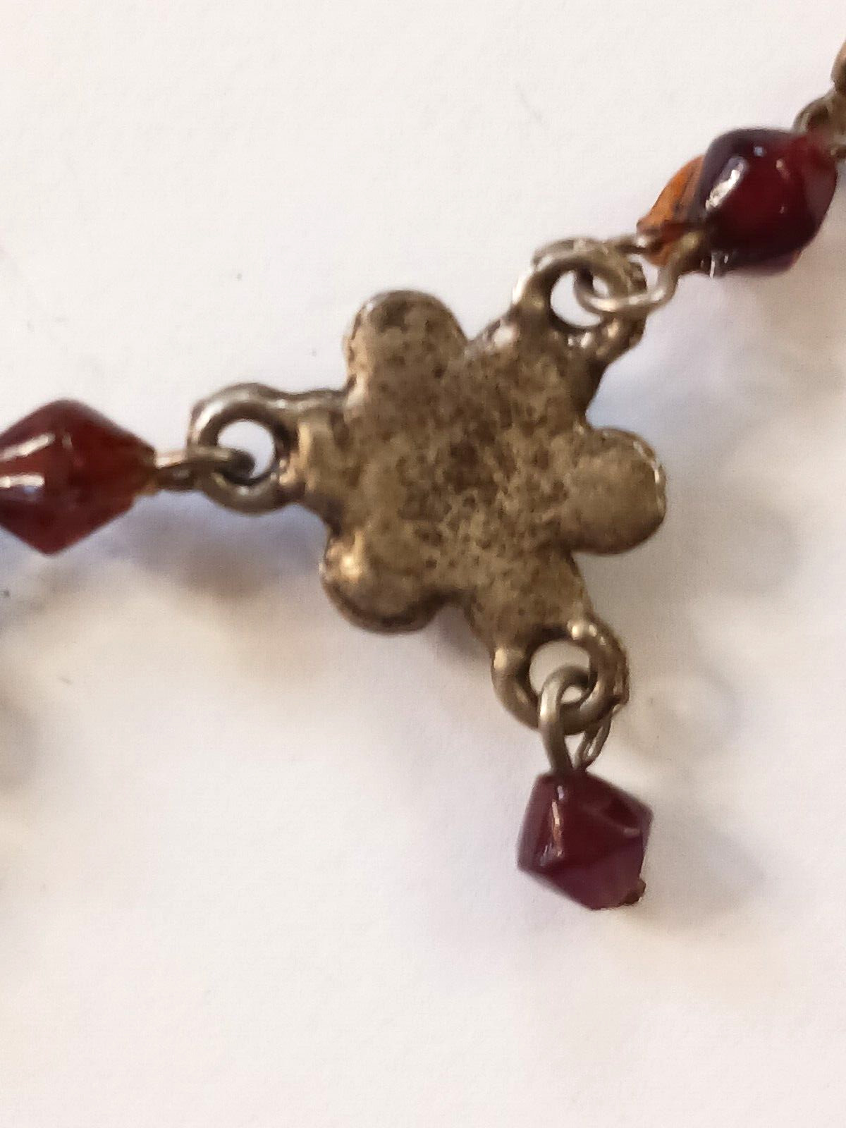 Beautiful silver tone necklace with flowers and red stones. hook clasp. Vintage