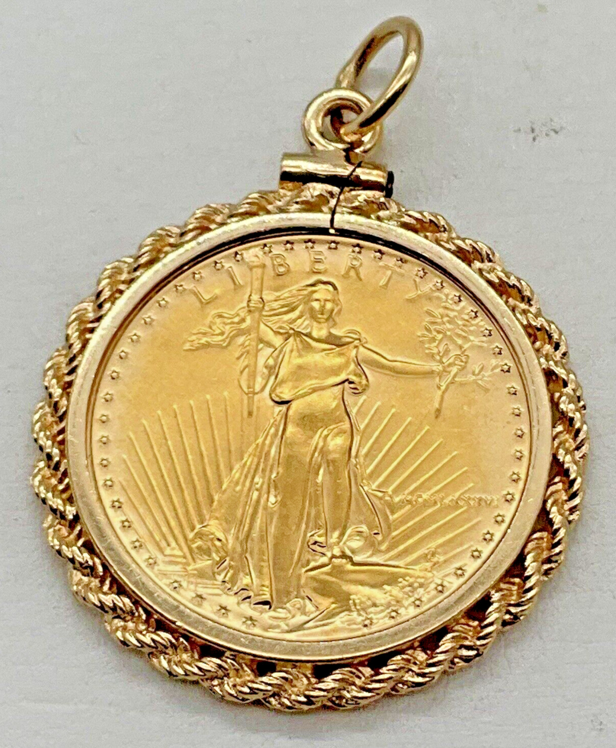 1/4 Ounce, 1986 American Eagle Coin In 14k Yellow Gold Rope Bezel Pendant