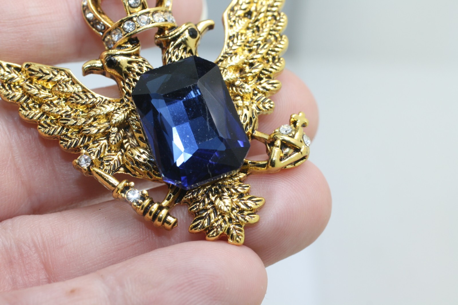 Gold tone double eagle crown blue emerald cut stone pendant regal style