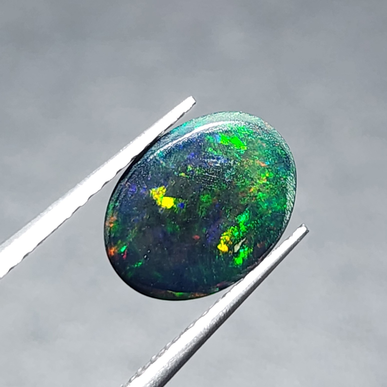 Natural Welo Black Opal Ethiopia Oval Cabochon Vivid Green Fire Gemstone 1.20Ct