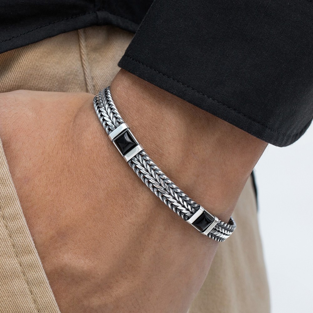 An elegant silver and onyx bracelet inspired by the allure of an Italian night