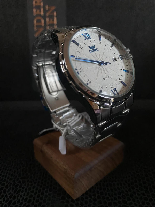 Classic Luxury Silver Quartz Watch with Blue Accents