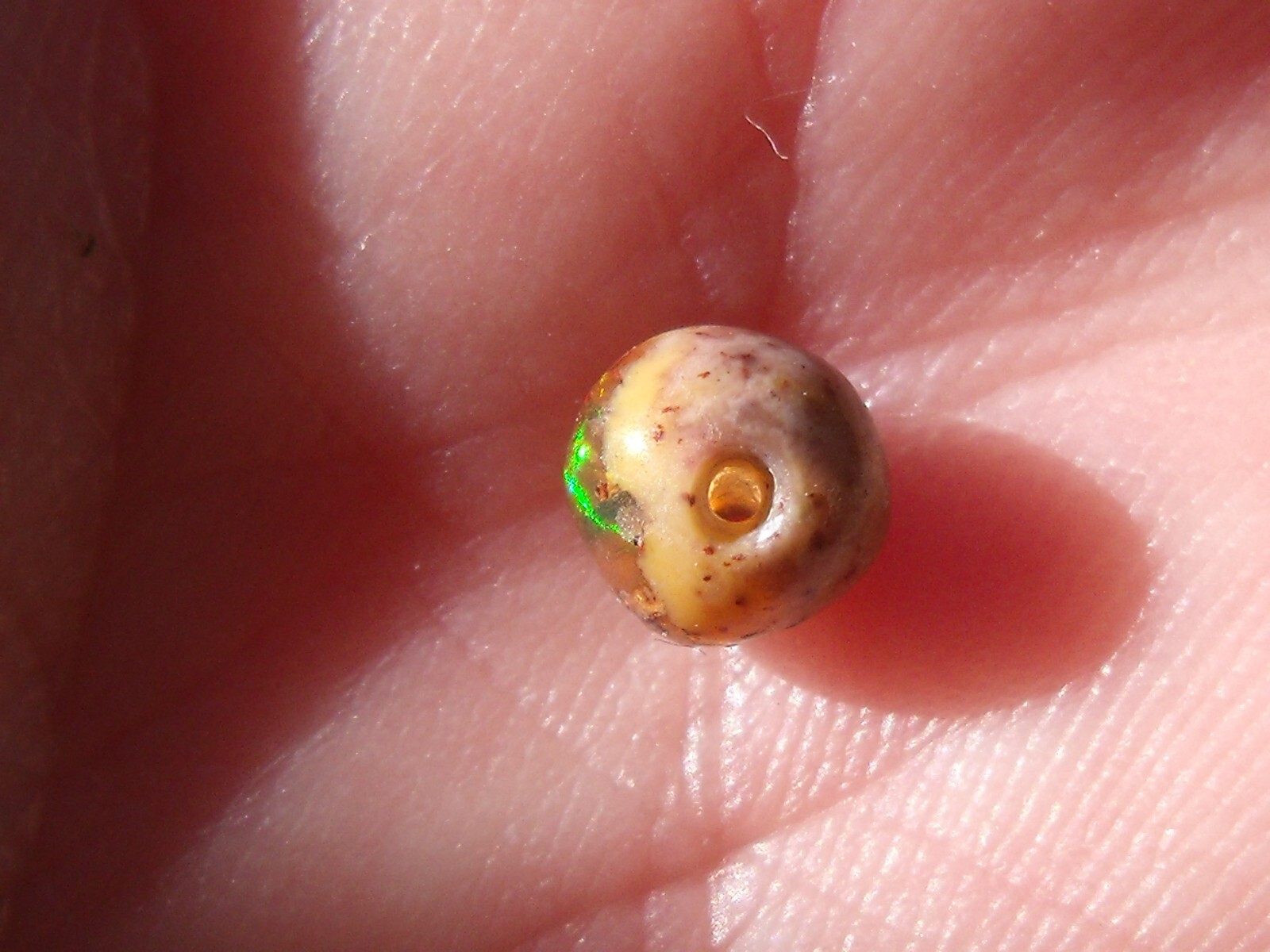 0.82 Ct. Round Cut Mexican Cantera fire opal bead.