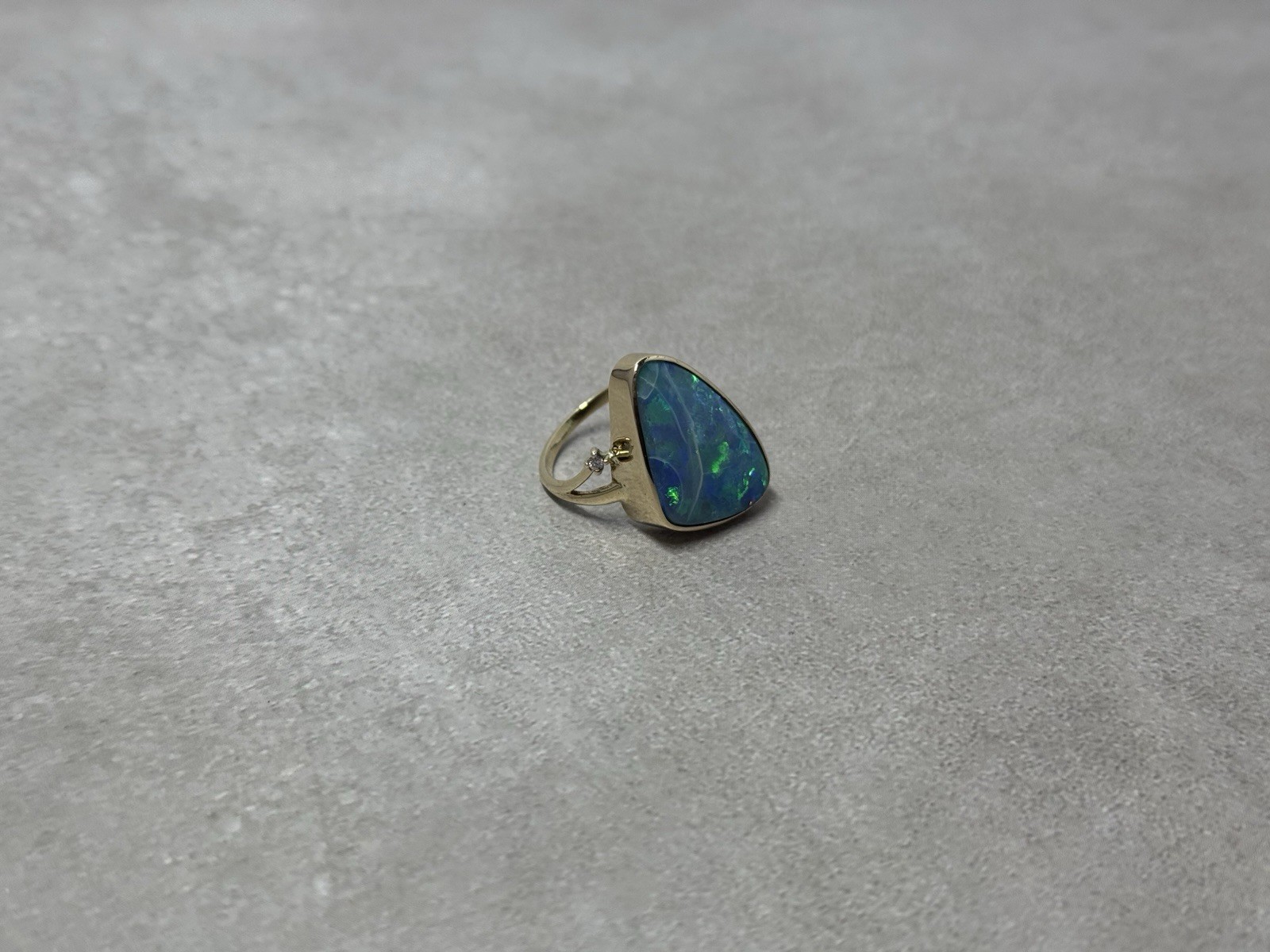 Natural Australian boulder opal with A 14k Gold ring And Diamonds. Ring size 8.