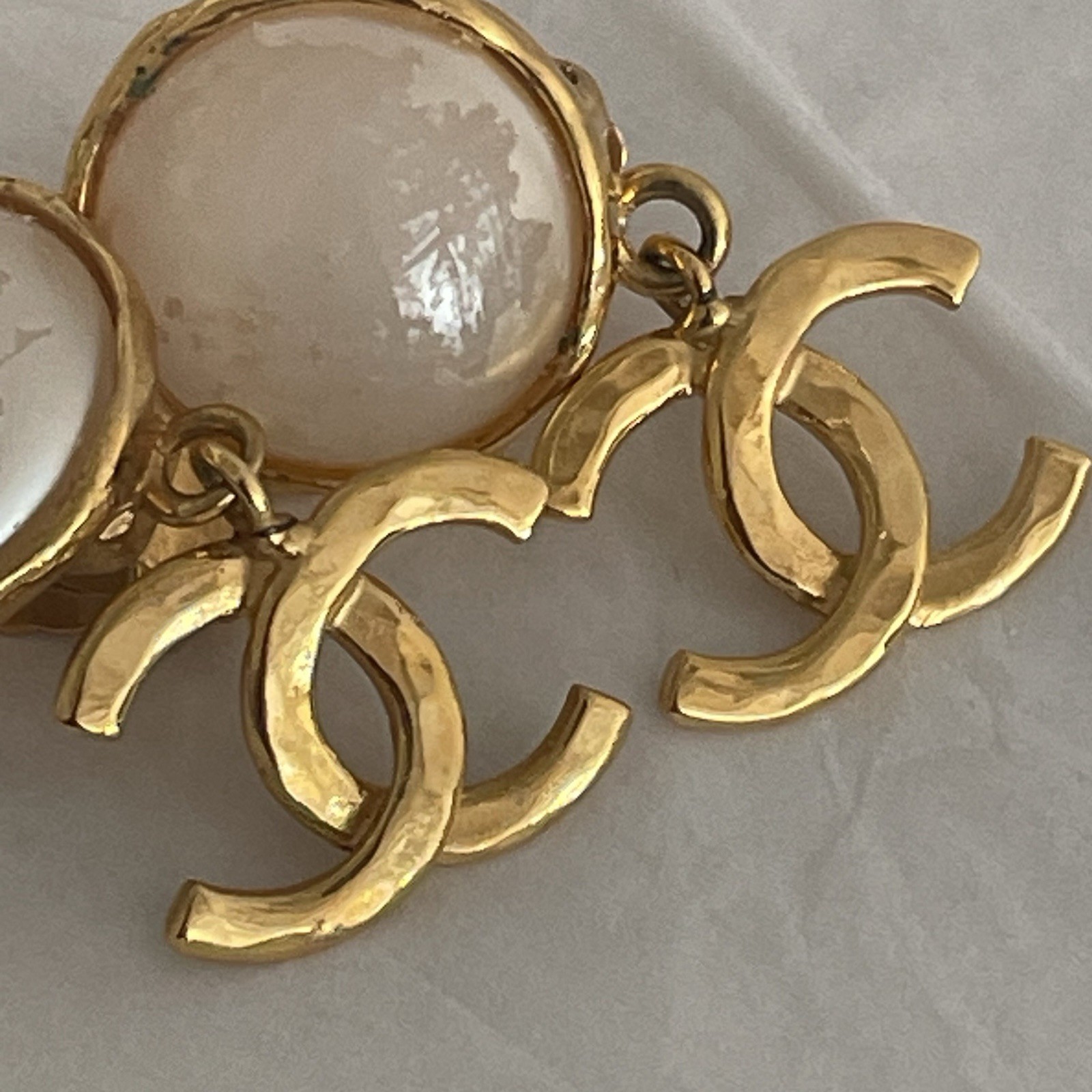 Auth. vtg CHANEL 1995 gold 3D CC logo dangle with round moonlight stone stamped