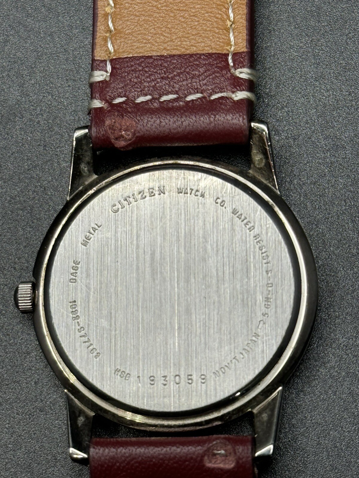 Citizen Quartz Silver Tone Dark Gray Dial Number-Less Watch Burgundy Strap
