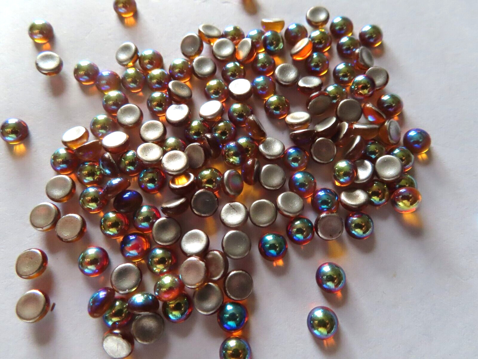 144 Czech. glass round cabochones in 5mm Amber AB.